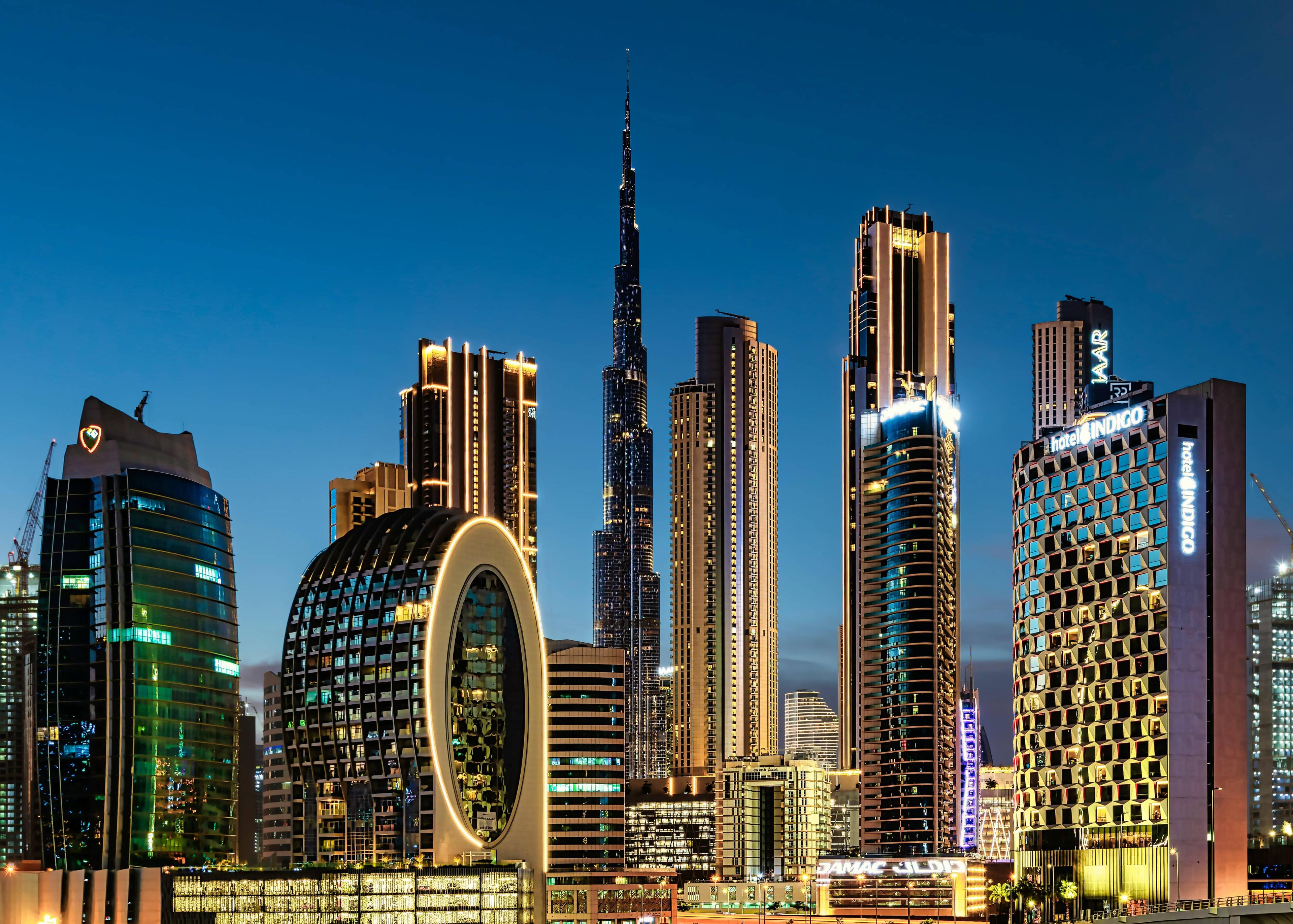 Dubai skyline at night with the illuminated Burj Khalifa