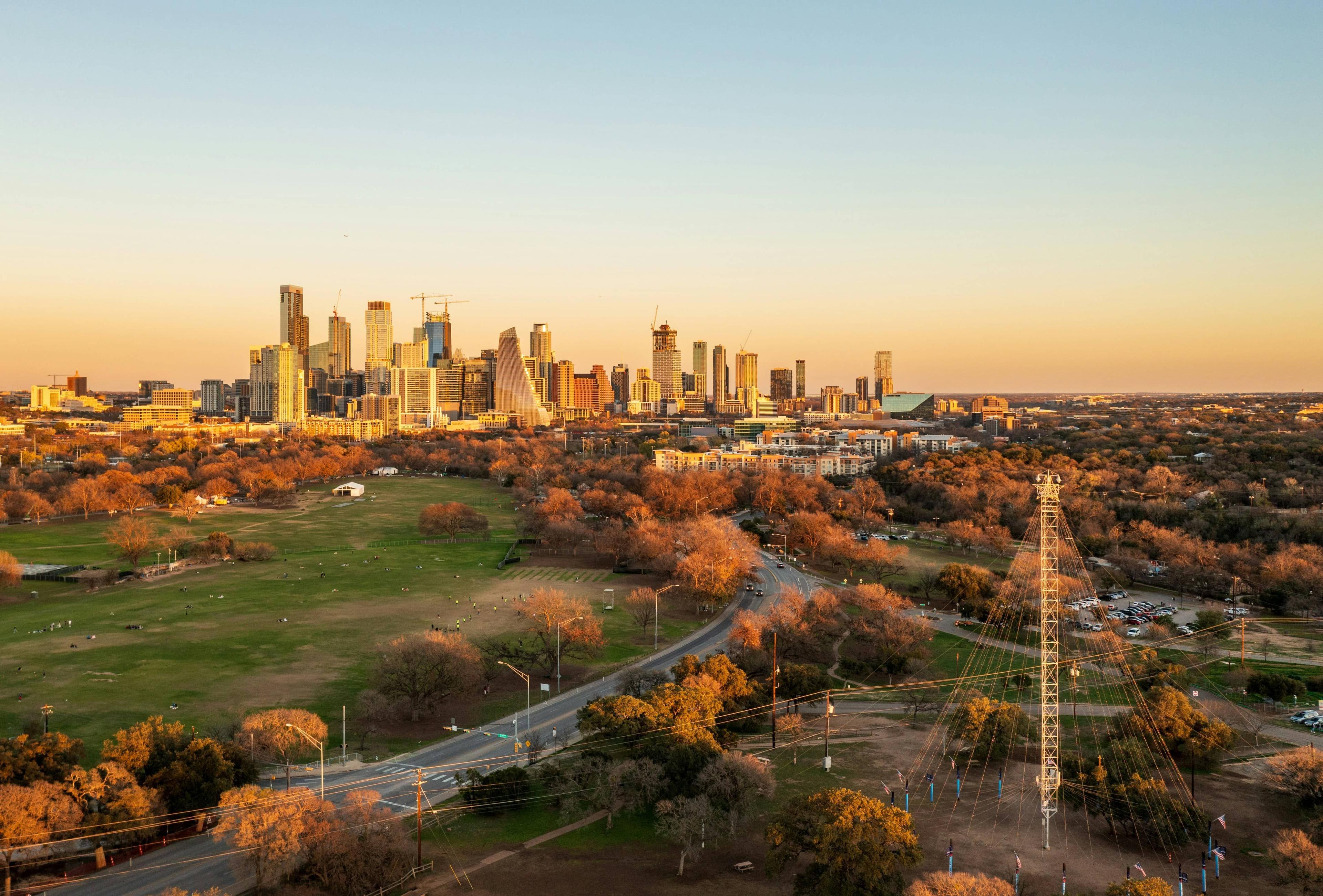 Austin skyline across a park at golden hour