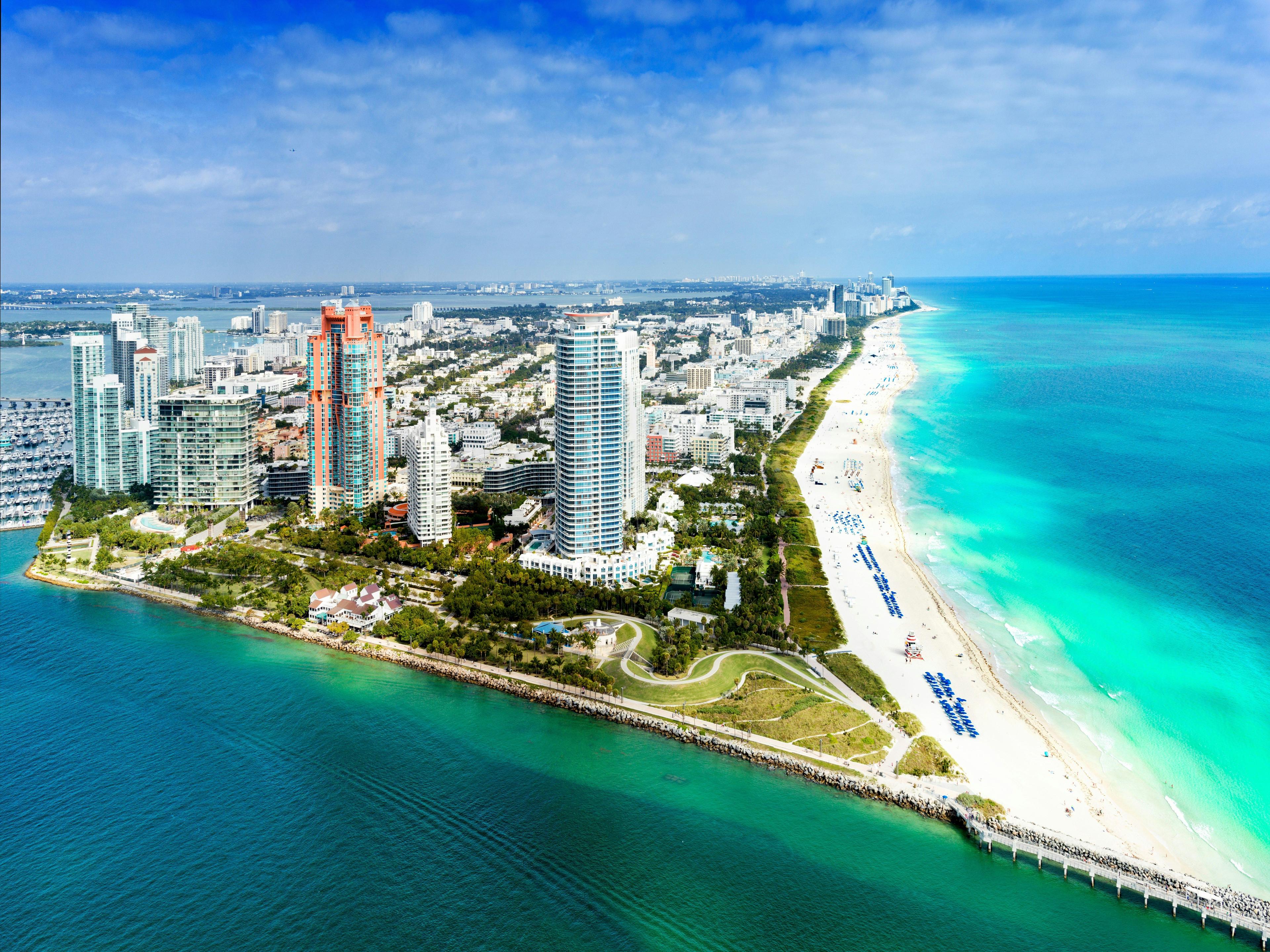 Aerial view of Miami Beach with skyscrapers and turquoise ocean