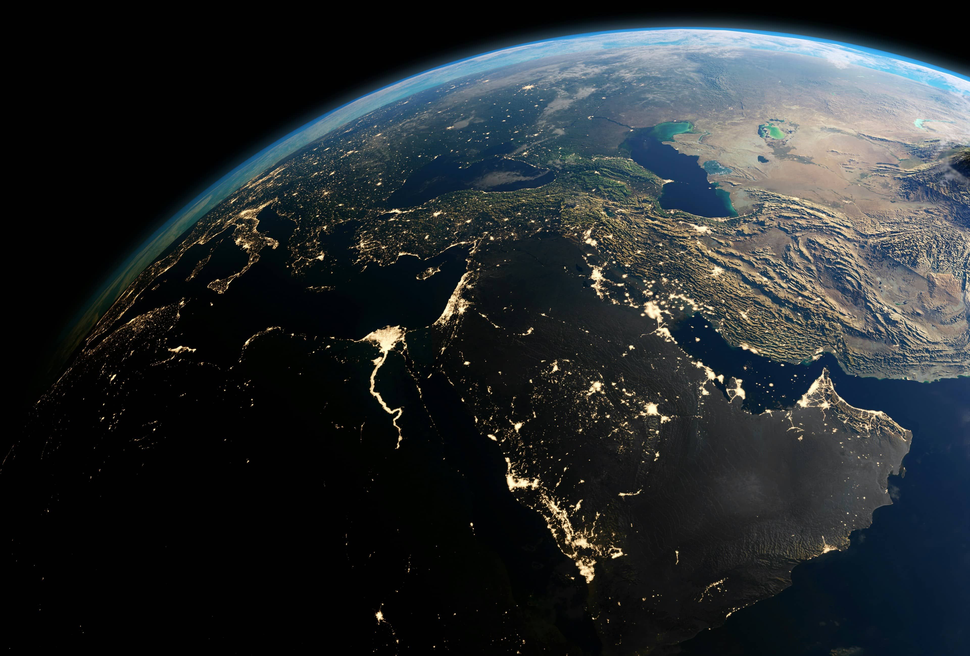 Earth from space at night, showing city lights across the Middle East.